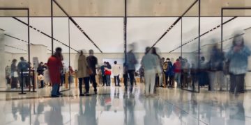 people walking on white floor tiles