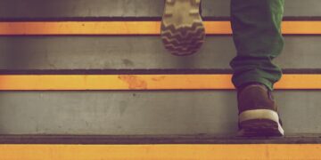 person wearing green pants