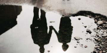 man and woman holding hand together