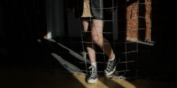 Person Standing behind a Net