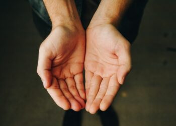 persons hand forming heart