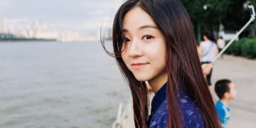 woman standing near body of water