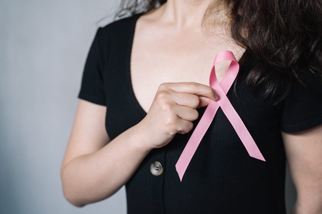 Woman Holding Pink Ribbon cancer
