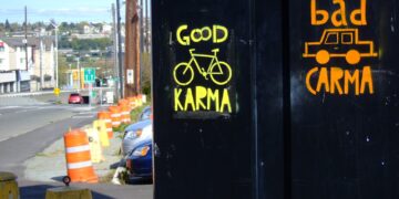 a couple of signs on the side of a road