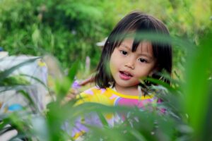 girl surrounded by plants