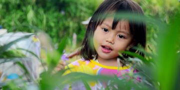 girl surrounded by plants