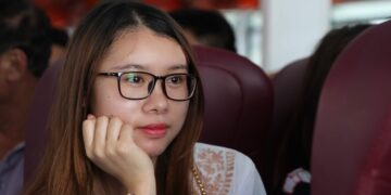 woman in white shirt wearing eyeglasses