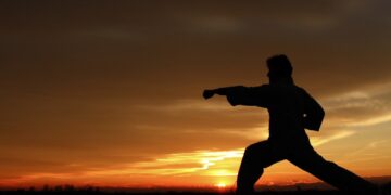 silhouette photography of man punching on air