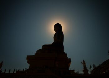 silhouette photo of Buddha statue