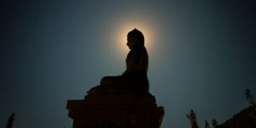 silhouette photo of Buddha statue